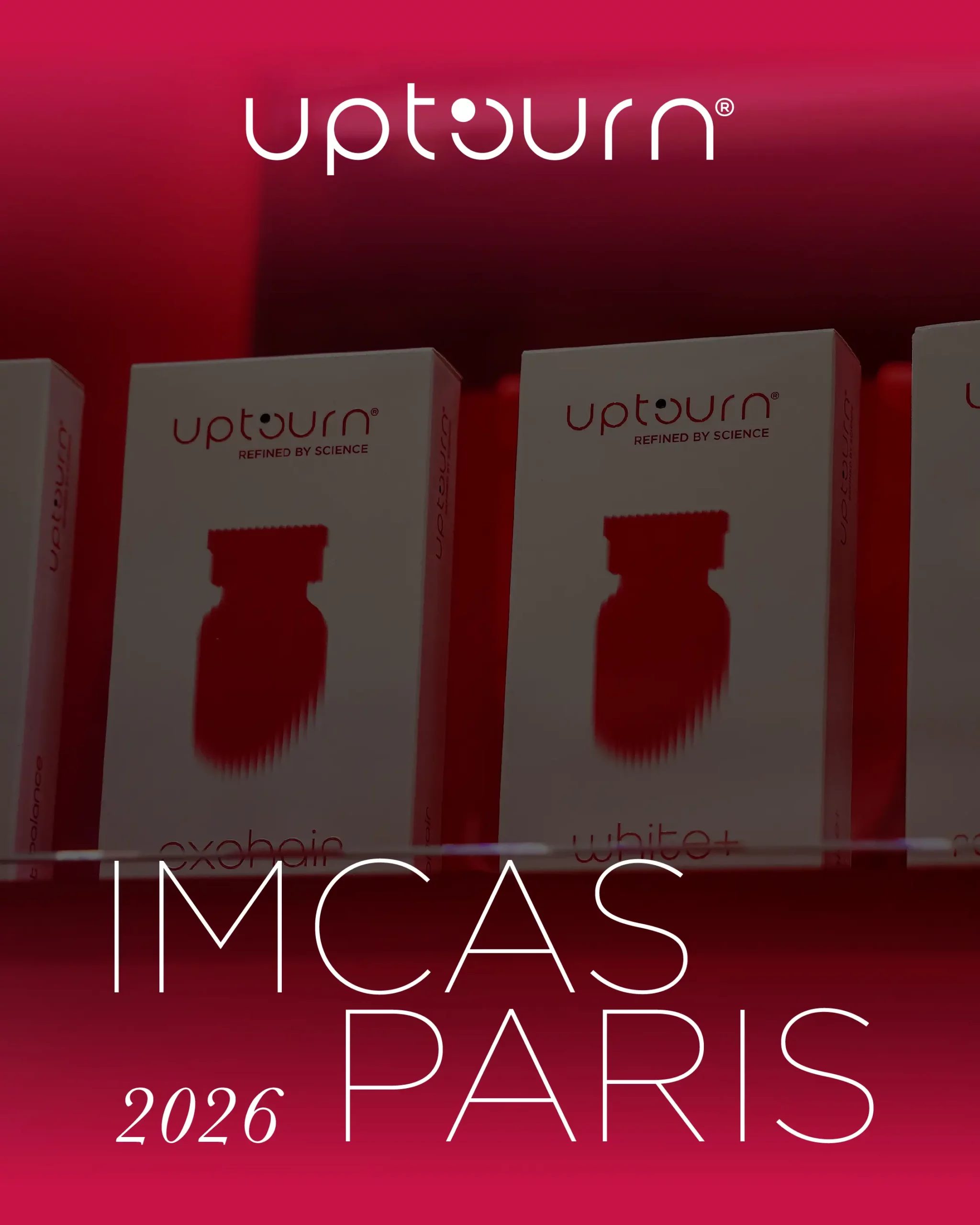 Boxes of Uptourn products displayed on a shelf with the Uptourn logo above and the event text “IMCAS PARIS 2026” at the bottom, all set against a red background.